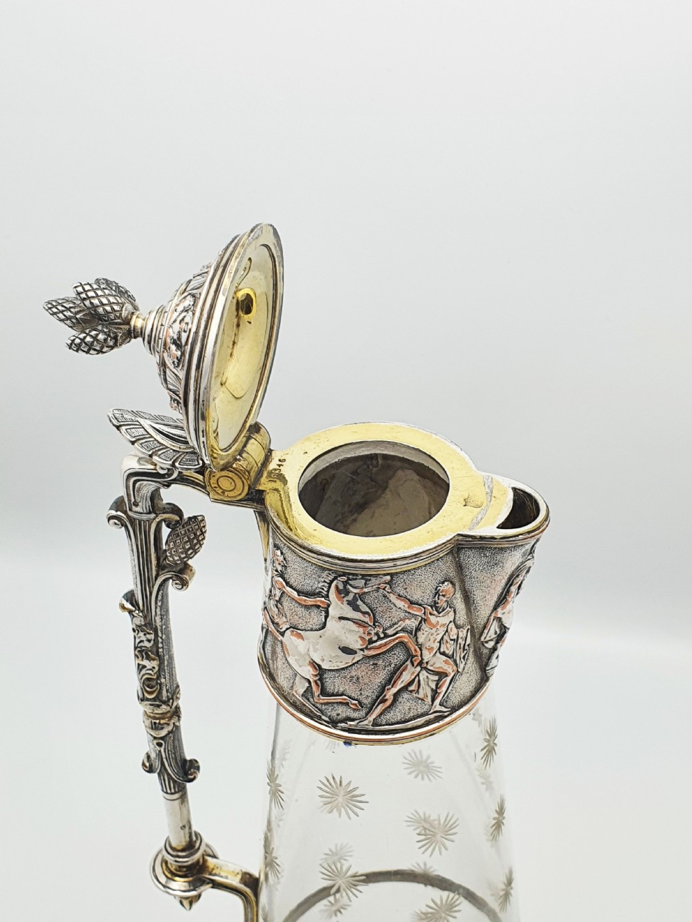 A tall Victorian silver-plated and etched glass claret jug featuring classical reliefs, a Greek key border, and star-cut engravings. View III