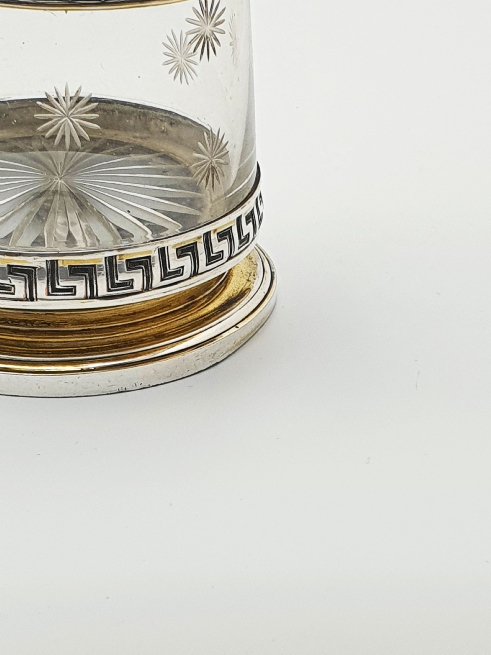 A tall Victorian silver-plated and etched glass claret jug featuring classical reliefs, a Greek key border, and star-cut engravings. View XII