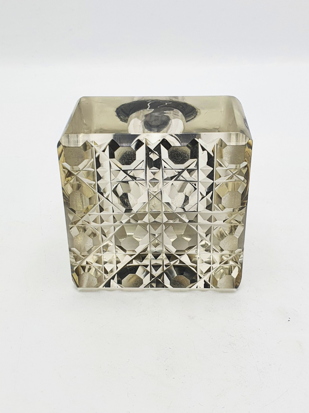 A square, heavy cut-glass antique inkwell featuring a diamond pattern and an ornate, embossed brass hinged lid. View V