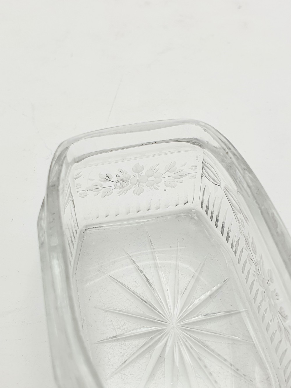 A rectangular clear etched glass dressing table jar topped with a sterling silver rim and a bright green guilloche enamel lid. View XIII
