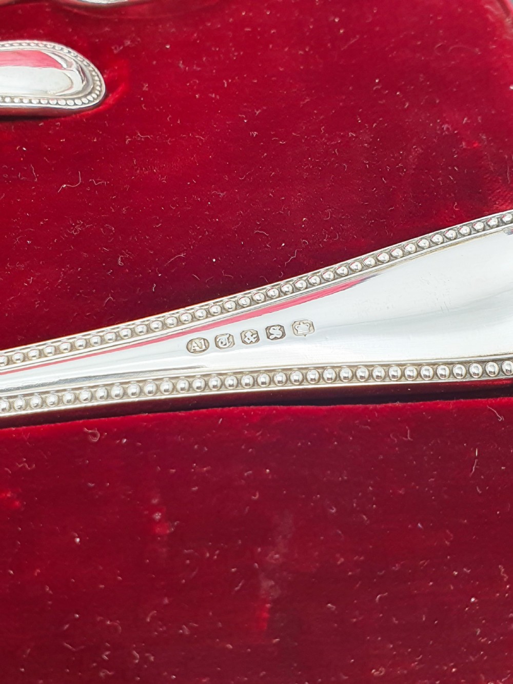 A Victorian silver-plated fruit serving set with embossed gilt bowls and grape shears, displayed inside a red velvet-lined presentation box. View VI