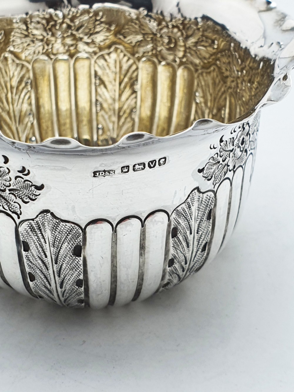 A small Late Victorian sterling silver bowl featuring fluted leaf decoration, floral engraving, a crimped rim, and a gilded interior. View III