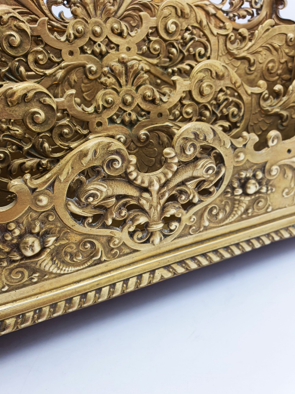 A cast brass Rococo Revival letter rack featuring three tiered compartments with intricate pierced scrollwork and foliate cresting. View V
