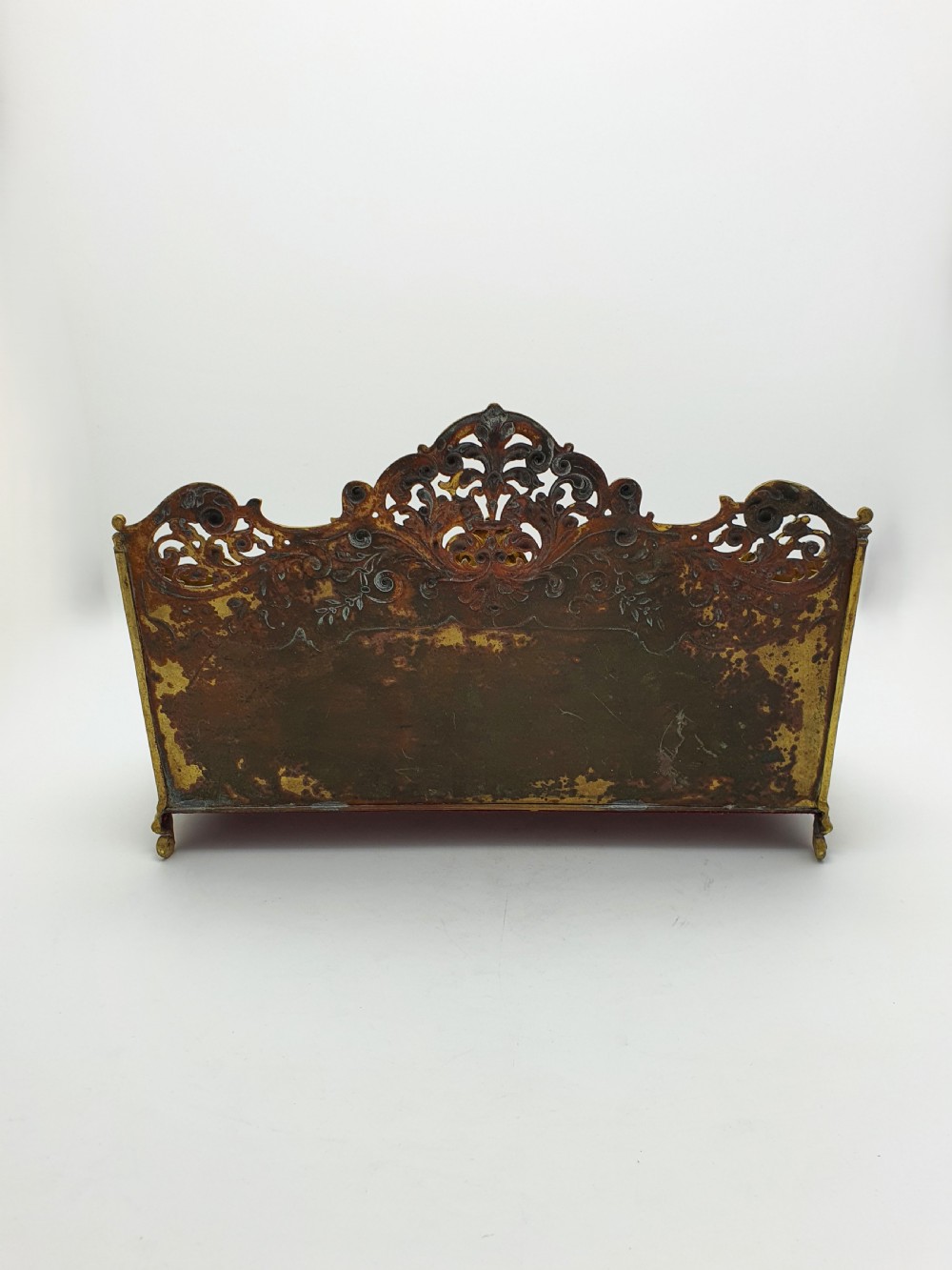 A cast brass Rococo Revival letter rack featuring three tiered compartments with intricate pierced scrollwork and foliate cresting. View VIII