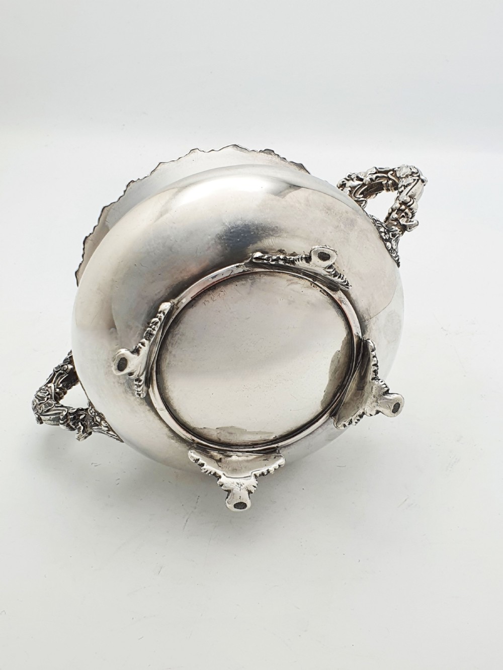 A Georgian silver-plated sugar bowl and matching cream jug with heavily carved scroll rims, double-scroll handles, and gilded interiors. View XI