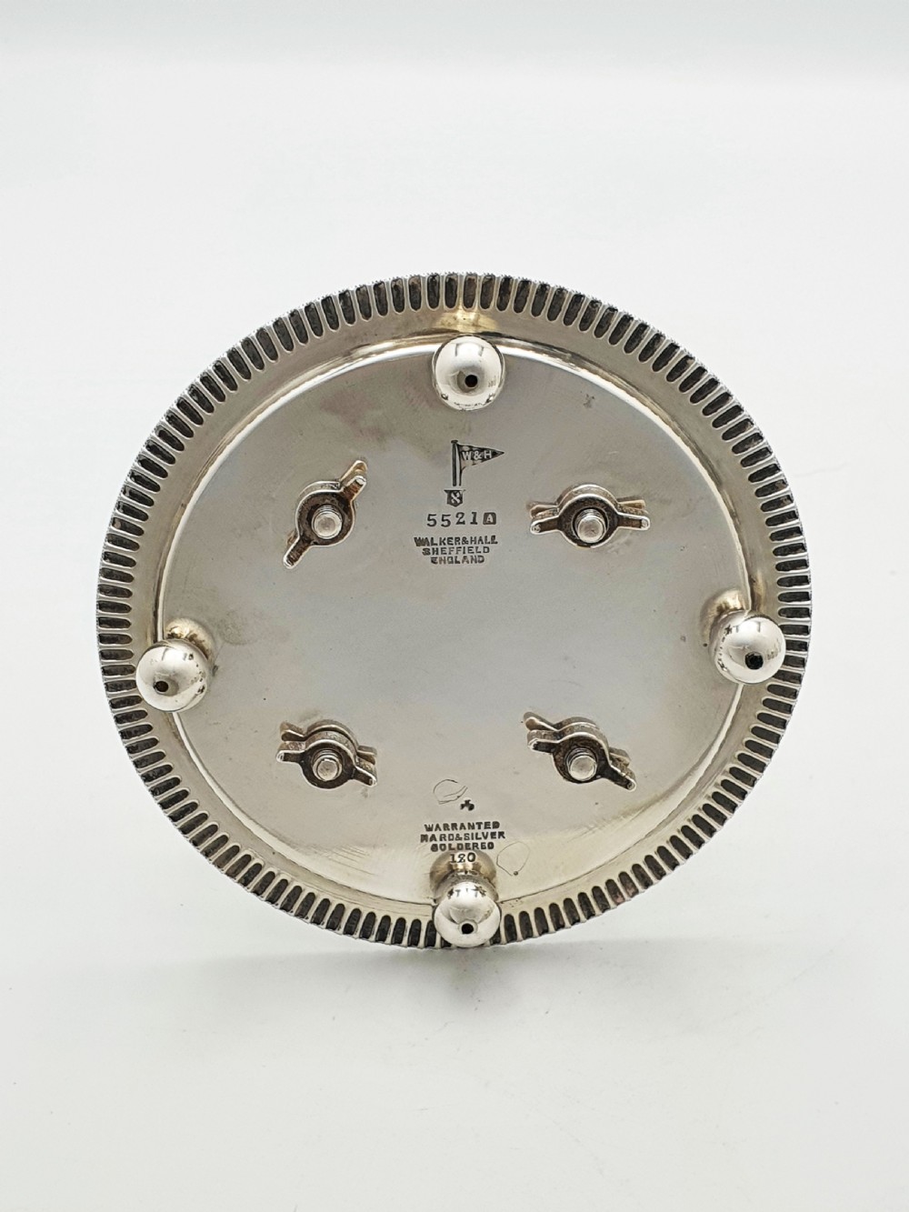 An antique silver-plated bachelor cruet set featuring cut-glass bottles on a circular gadrooned tray with a central carrying handle. View IX