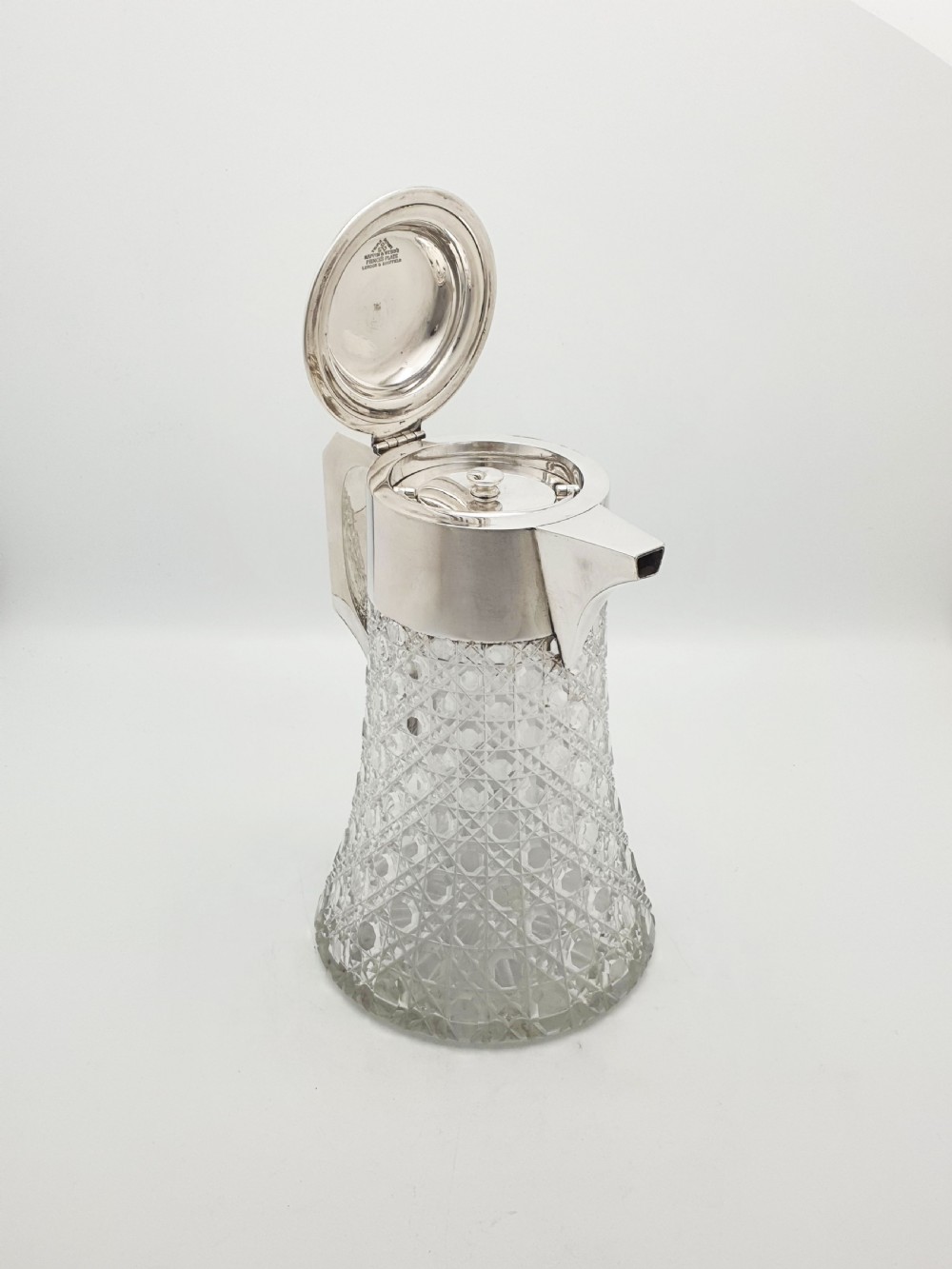 An antique Victorian cut glass lemonade jug featuring a silver-plated hinged lid and spout alongside its removable clear glass ice tube insert. View III