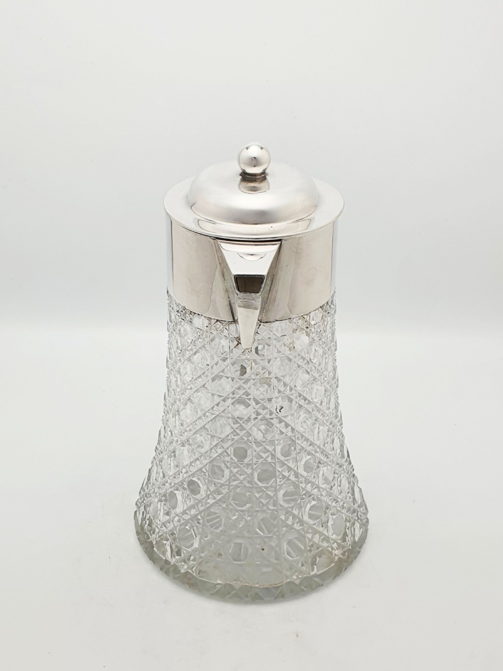An antique Victorian cut glass lemonade jug featuring a silver-plated hinged lid and spout alongside its removable clear glass ice tube insert. View IX