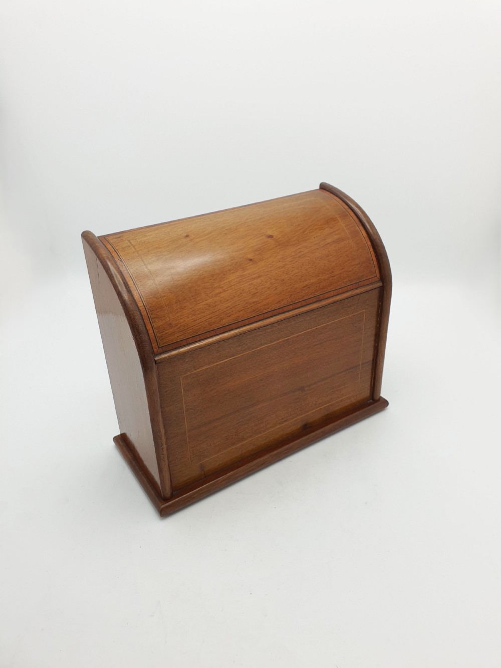 An antique Edwardian mahogany desk tidy featuring a hinged slanted lid, internal letter dividers, and line-inlaid boxwood detail on the front. View II