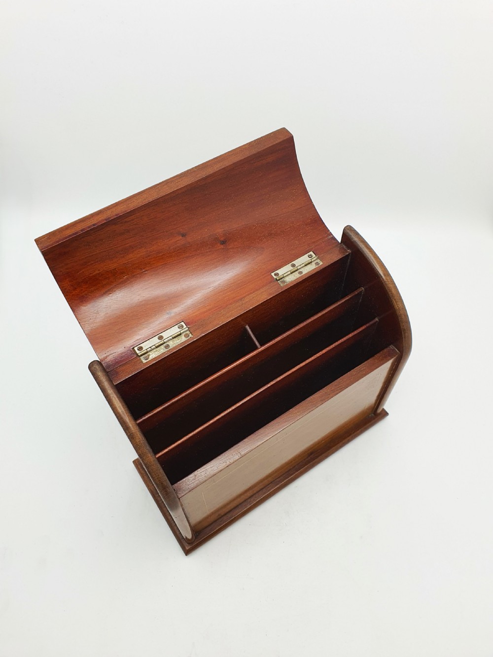 An antique Edwardian mahogany desk tidy featuring a hinged slanted lid, internal letter dividers, and line-inlaid boxwood detail on the front. View IV