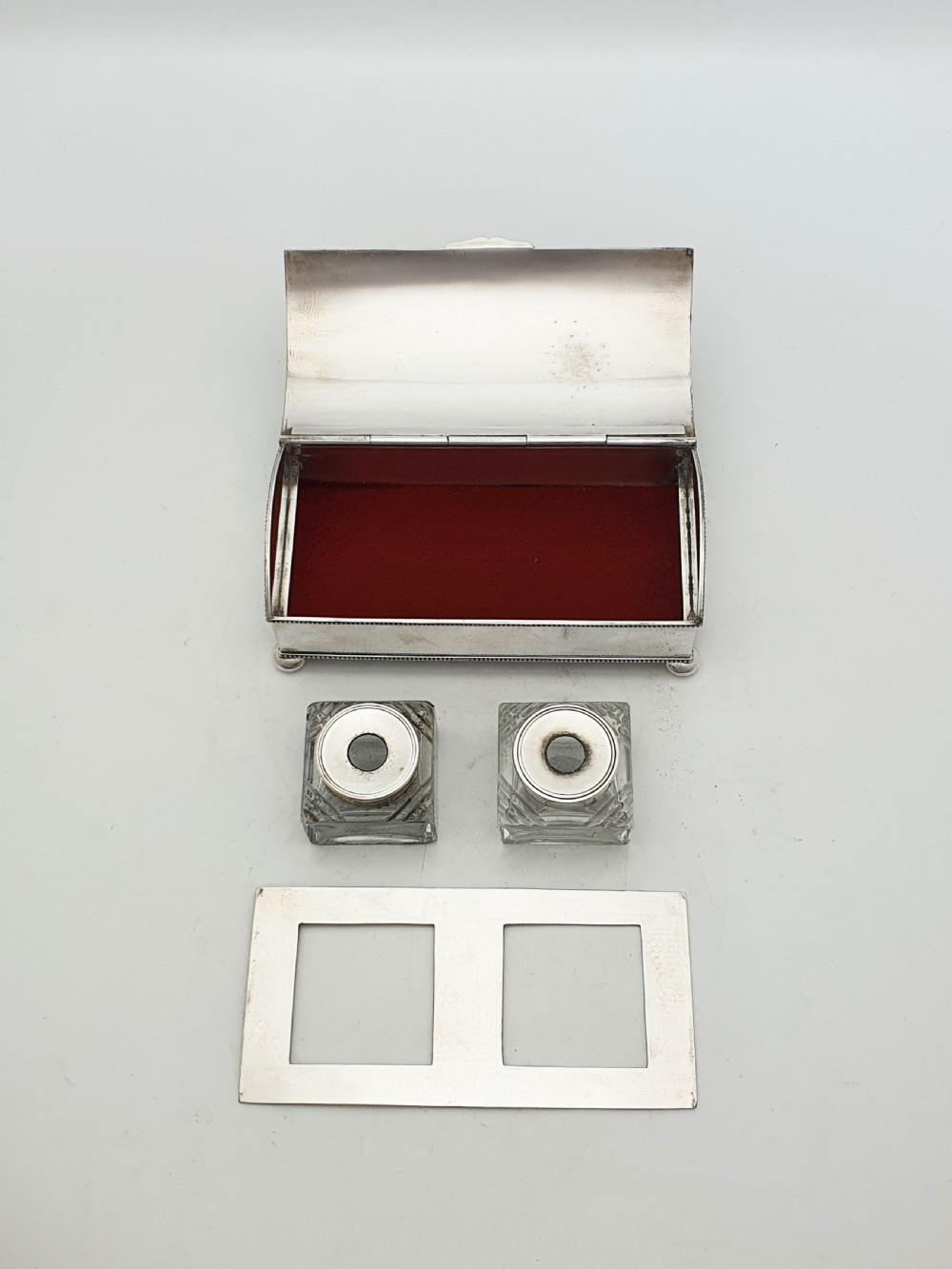 An Edwardian silver-plated rectangular inkstand box featuring a domed hinged lid, beaded border rims, and small ball feet. View III