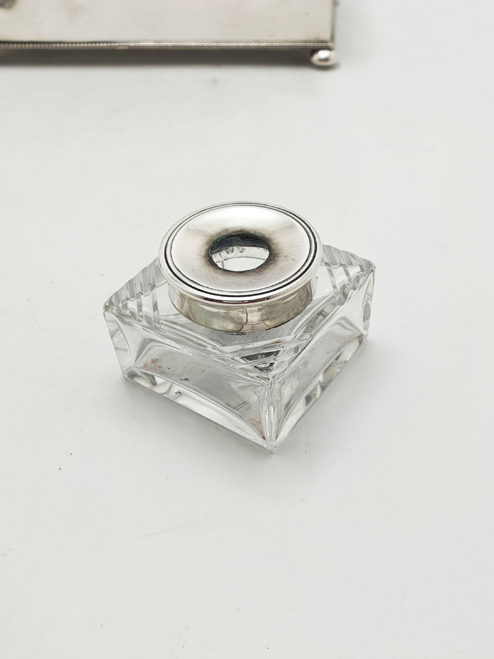An Edwardian silver-plated rectangular inkstand box featuring a domed hinged lid, beaded border rims, and small ball feet. View IV