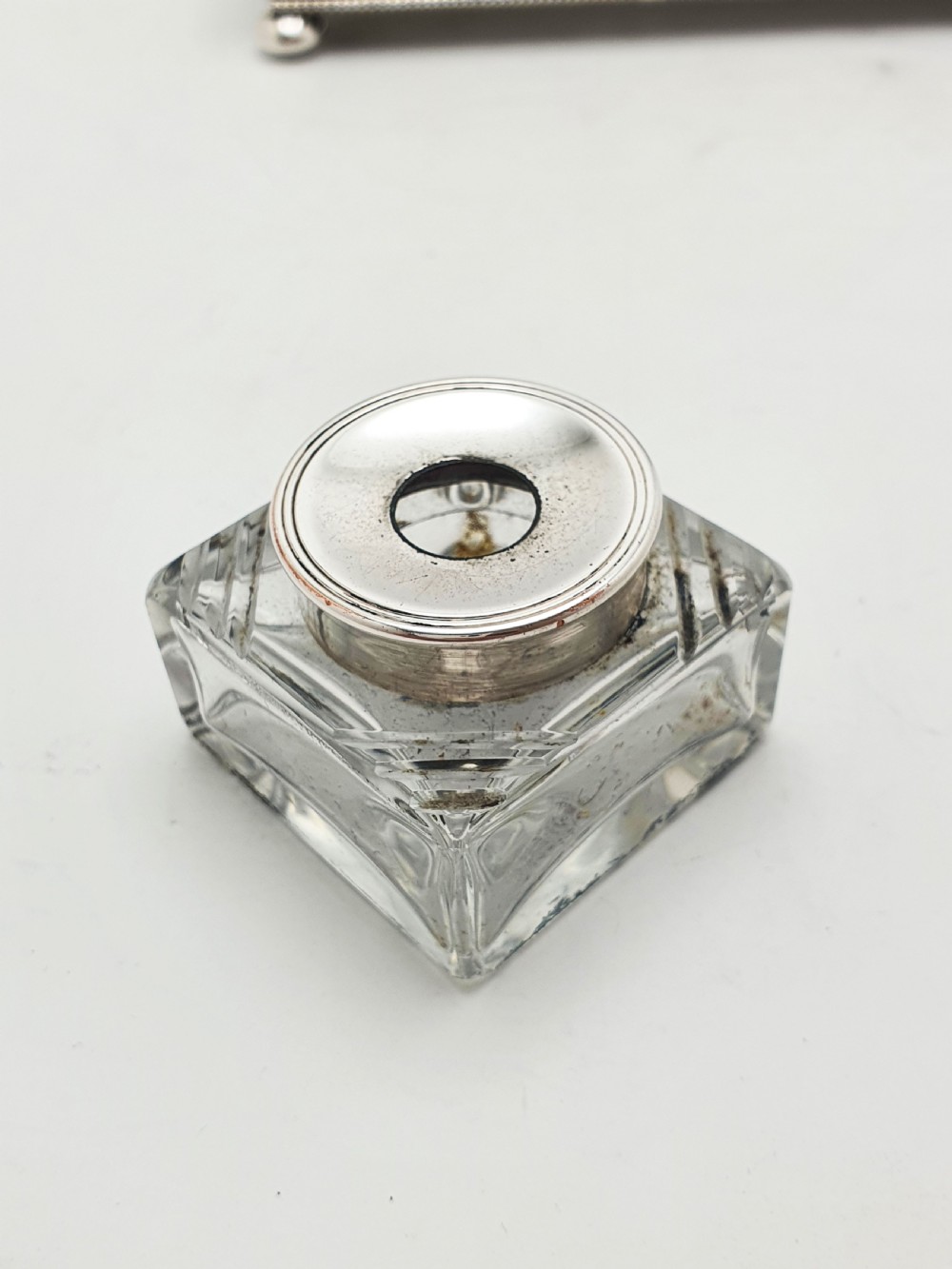 An Edwardian silver-plated rectangular inkstand box featuring a domed hinged lid, beaded border rims, and small ball feet. View V
