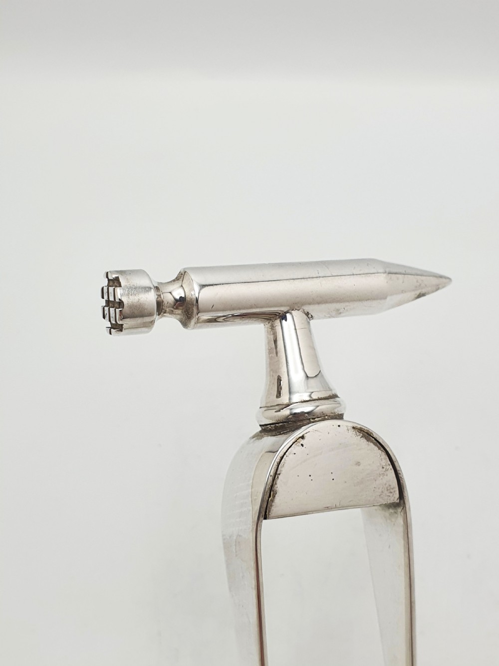 A pair of silver-plated Art Deco ice tongs featuring bird claw grippers and a top-mounted ice pick hammer head. View IV