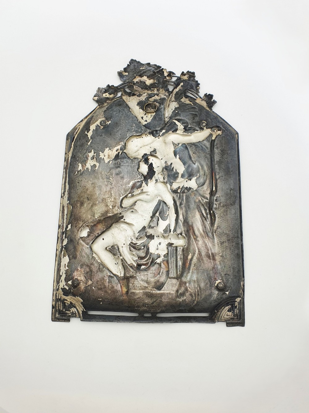 An arched silver-plated metal relief wall plaque featuring a classical mythological figure scene framed by grapevines and geometric motifs. View V