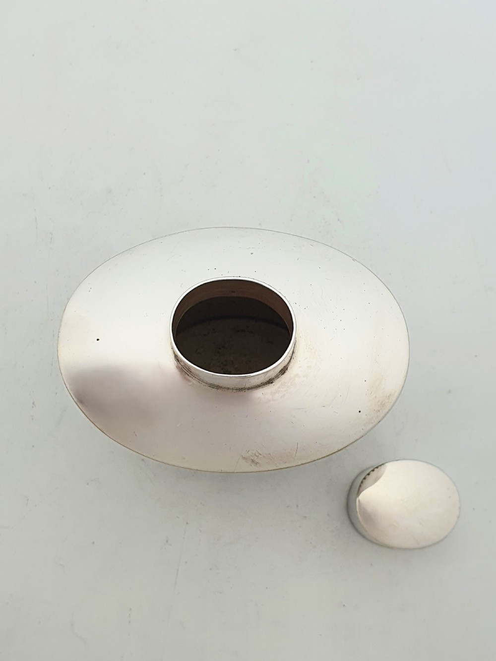 An Edwardian silver-plated tea canister featuring fluted body decoration and a fitted push-on lid. View IV