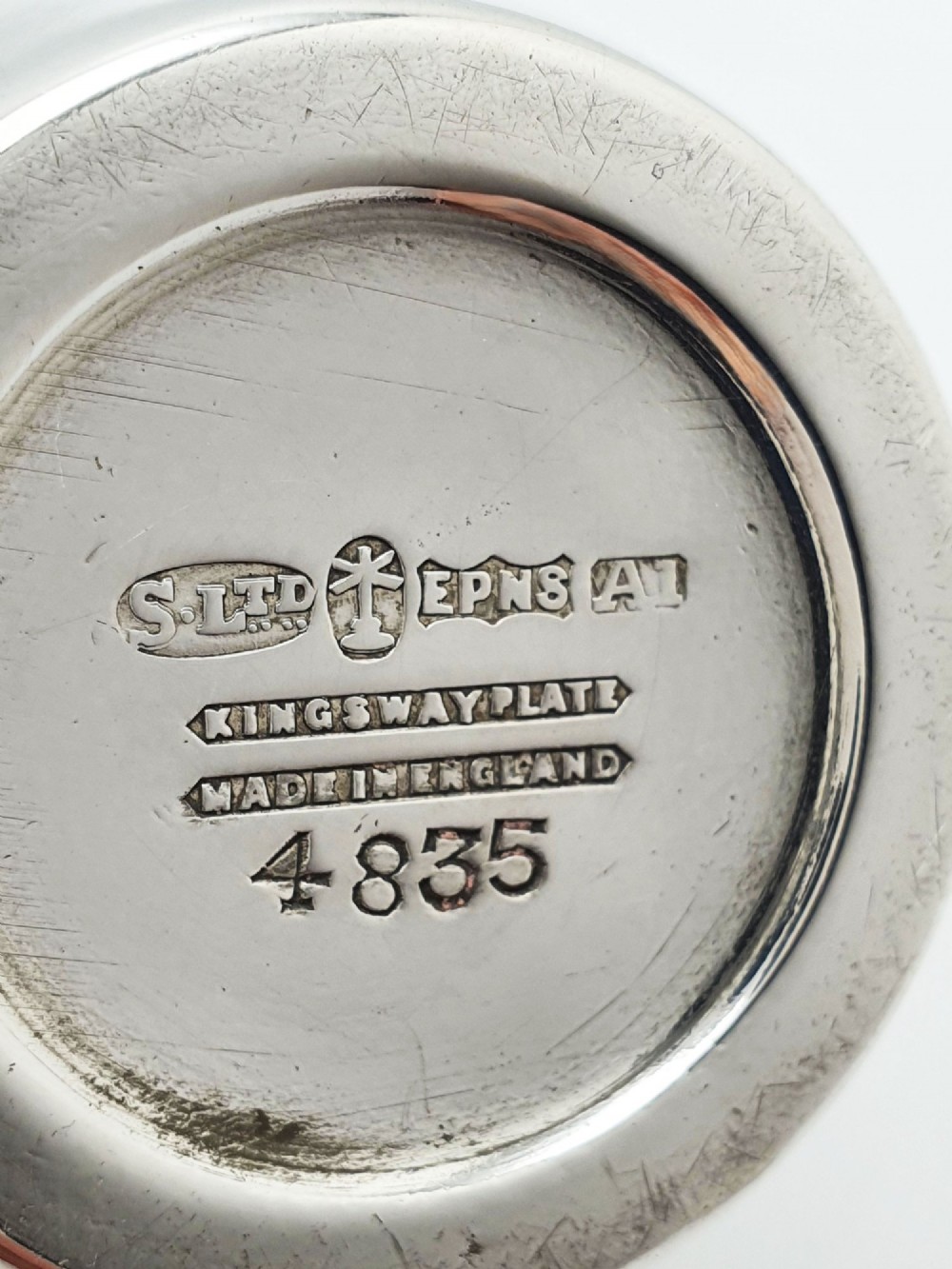 A silver-plated Art Deco bachelor cocktail shaker featuring a baluster body, milled collar, and a domed cap. View IV