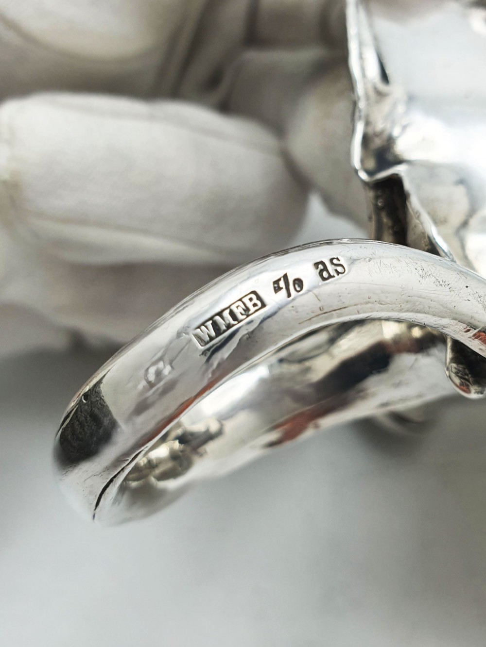 An Art Nouveau silver-plated chamberstick featuring a leaf-form tray base, organic sconce nozzle, and a looped handle. View VII