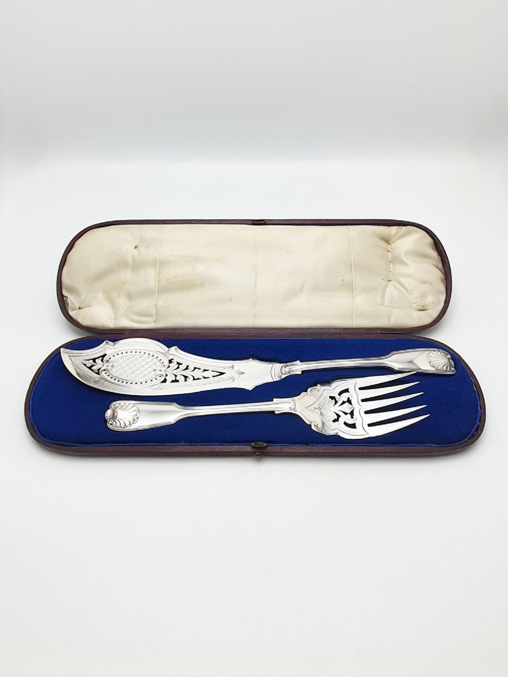 An antique Victorian silver-plated fish serving set with an engraved knife and fork presented in a fitted satin and velvet lined case. View II