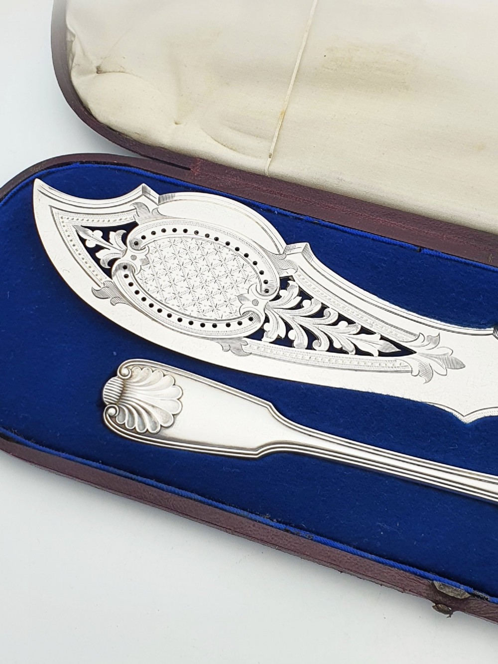 An antique Victorian silver-plated fish serving set with an engraved knife and fork presented in a fitted satin and velvet lined case. View III