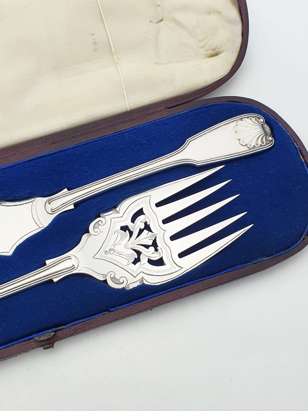 An antique Victorian silver-plated fish serving set with an engraved knife and fork presented in a fitted satin and velvet lined case. View IV
