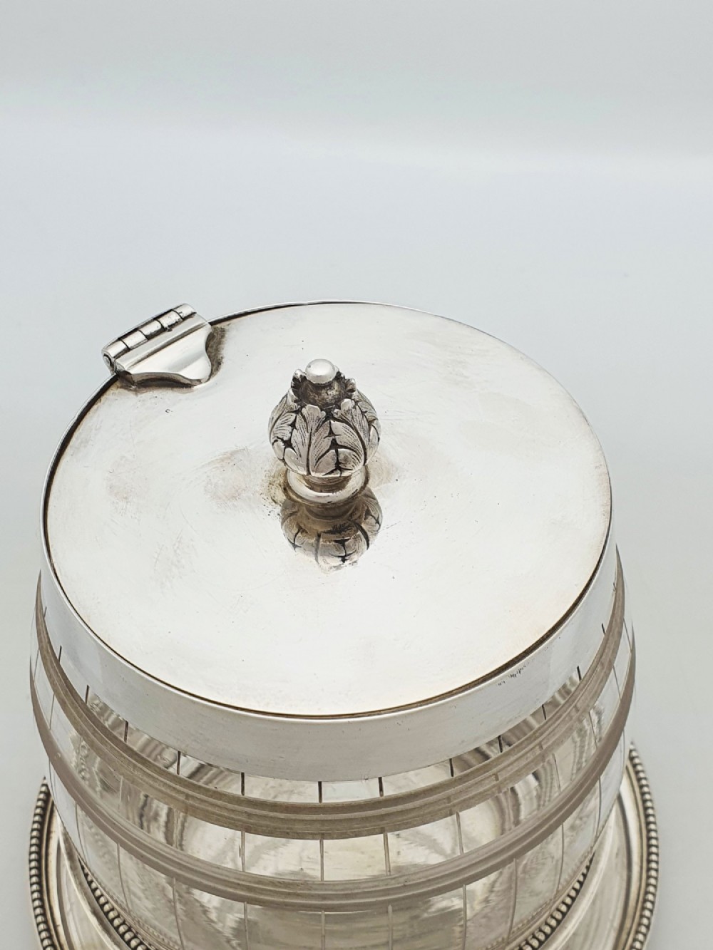 A Victorian cut glass barrel-shaped container with a silver-plated hinged lid and matching stand. View III