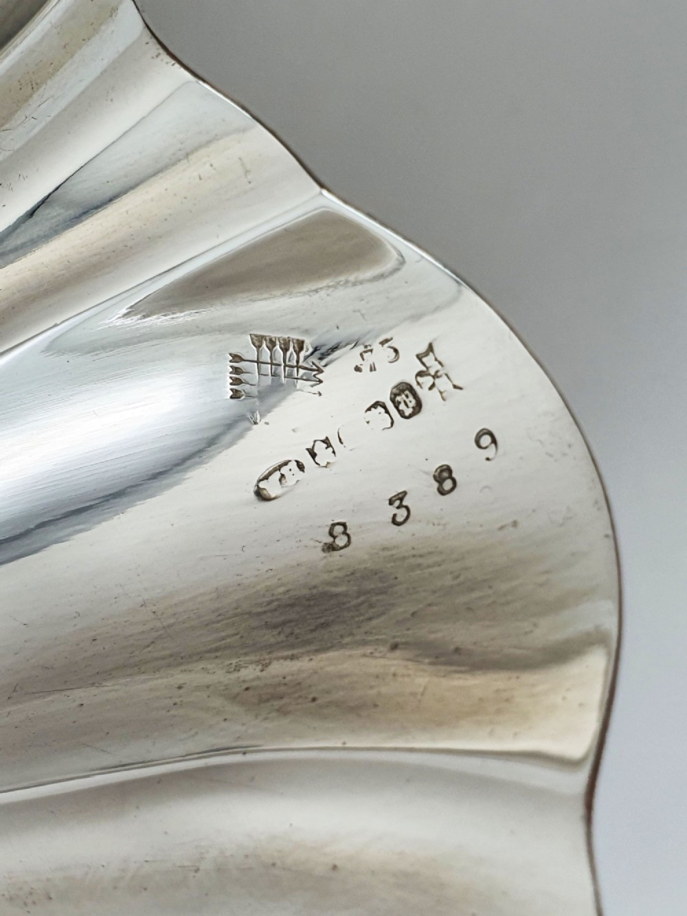 A Victorian silver-plated dish featuring two fluted shell-shaped compartments joined by a central handle modelled as textured coral. View VII