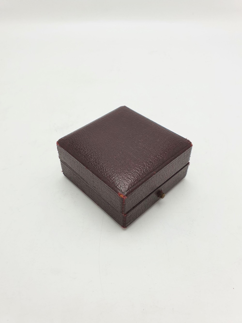 A vintage Edwardian folding brass linen tester loupe with a glass lens and measuring scale engraved on the base plate. View III