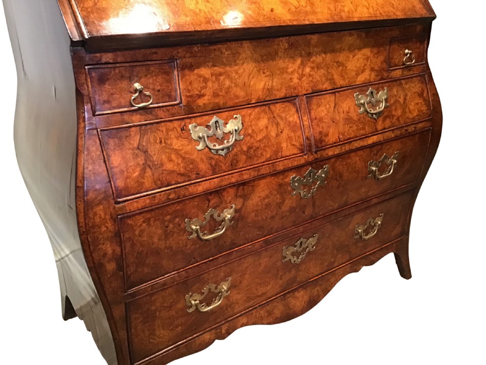 A two-part Georgian walnut bureau bookcase featuring a moulded top cabinet with two glazed doors above a fall-front desk with a green leather writing surface and a shaped lower drawer base. View IV