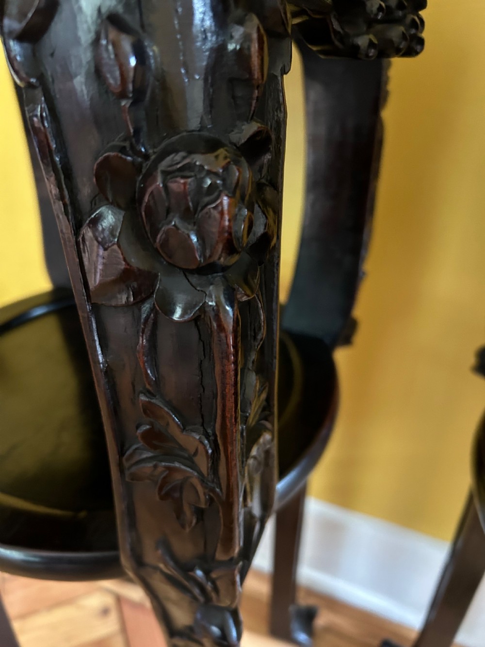 A pair of octagonal Chinese dark padouk wood plant stands with inset marble tops, pierced openwork aprons, lower shelves, and claw feet. View VI