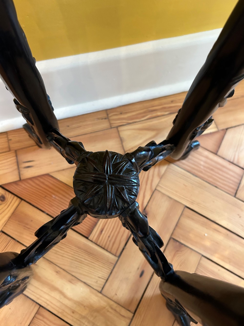 An intricately carved dark hardwood Chinese plant stand featuring an octagonal beaded top, openwork floral apron, cabriole legs, and a carved lower cross-stretcher. View VIII