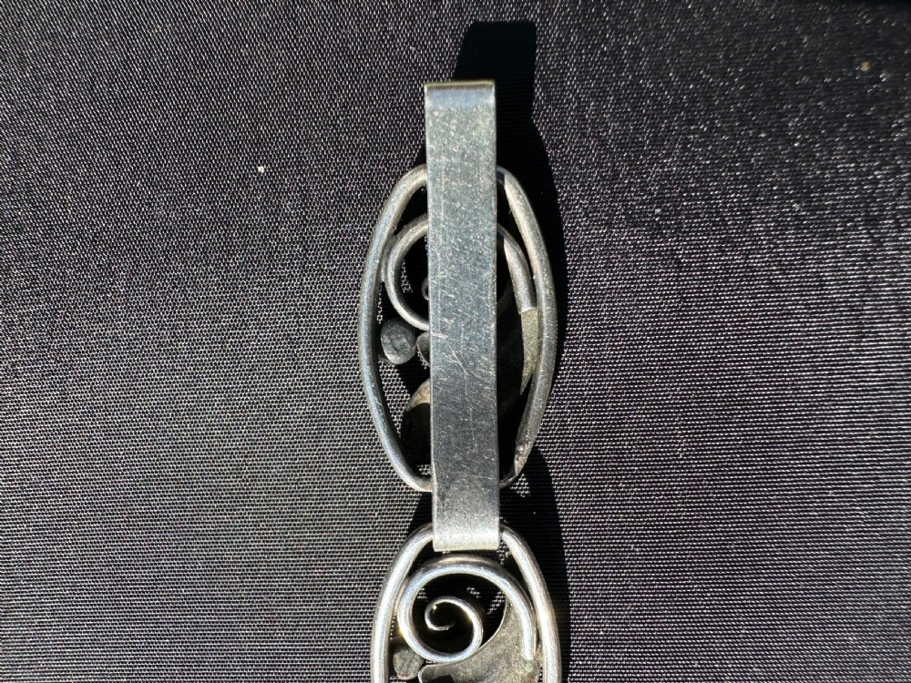 A Danish 830 silver link bracelet featuring oval openwork links with sculpted leaf forms, spiral scrolls, and bead accents. View VIII