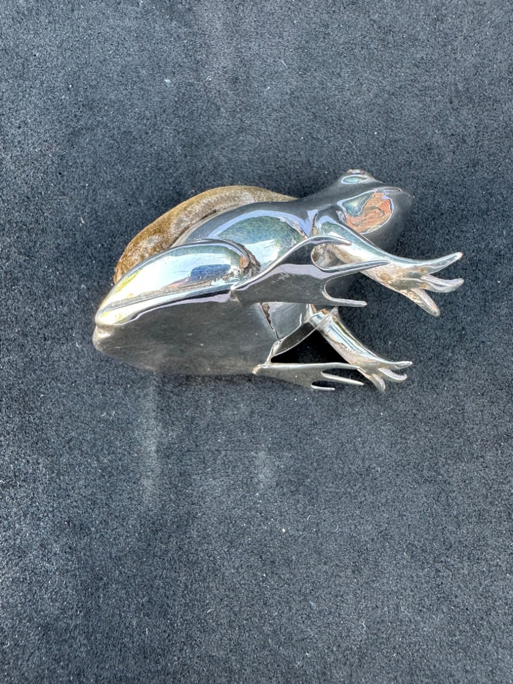 An Edwardian sterling silver pin cushion cast in the shape of a frog with an embedded brown fabric cushion on its back. View III