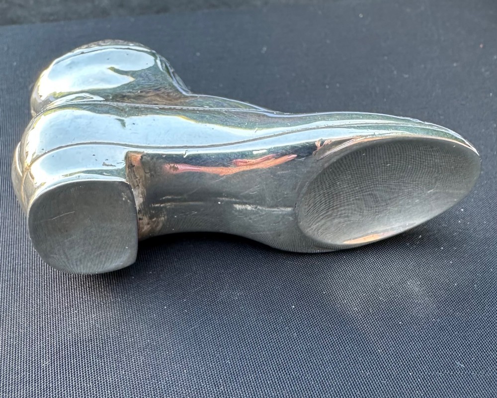 An antique sterling silver pin cushion formed in the shape of a lace-up shoe with a dark red velvet cushion insert. View III