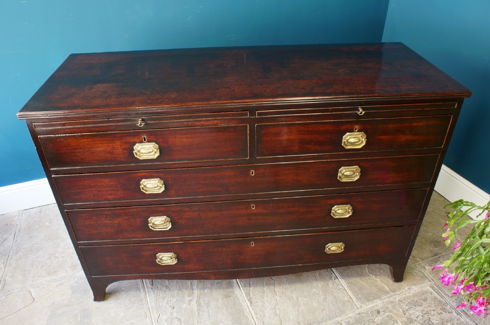 A George III mahogany chest of drawers View II