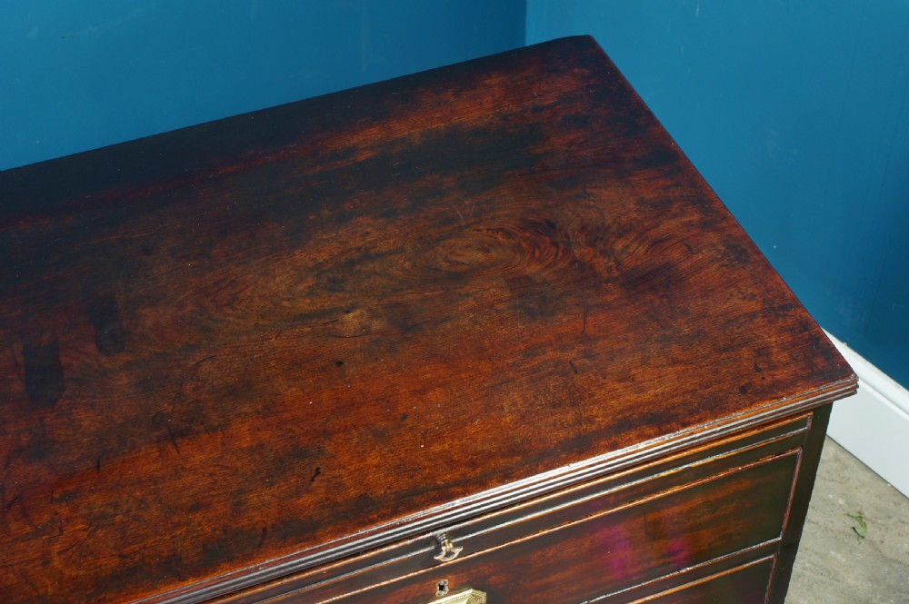 A George III mahogany chest of drawers View VI