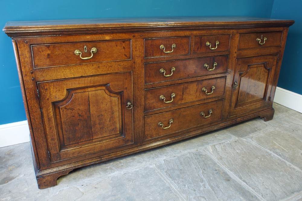 A superb large English 18th Century Oak Dresser base. View III