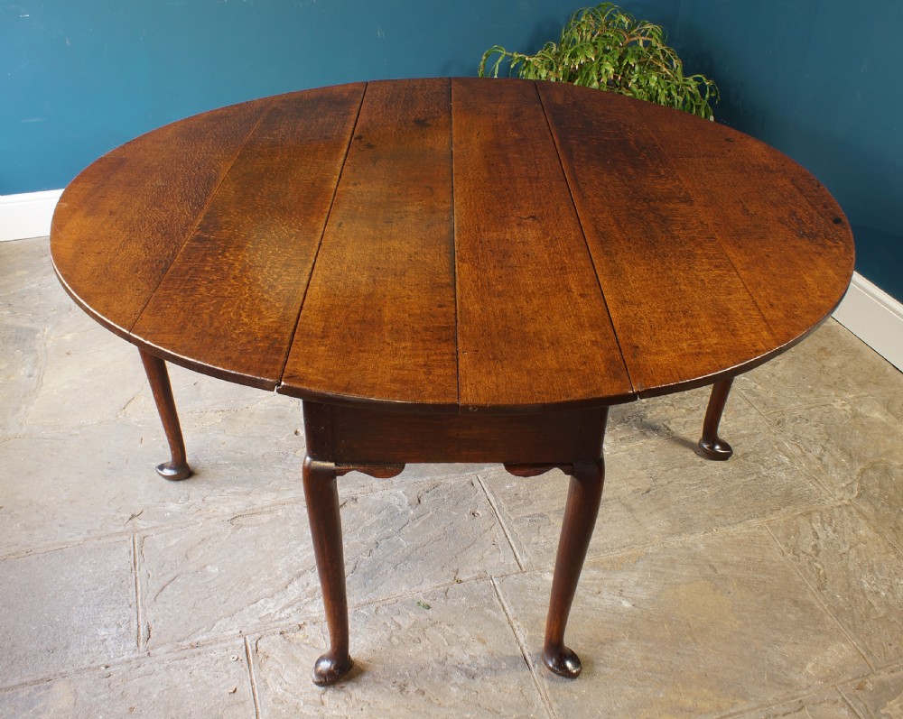 A large 18th Century Oak drop leaf table.