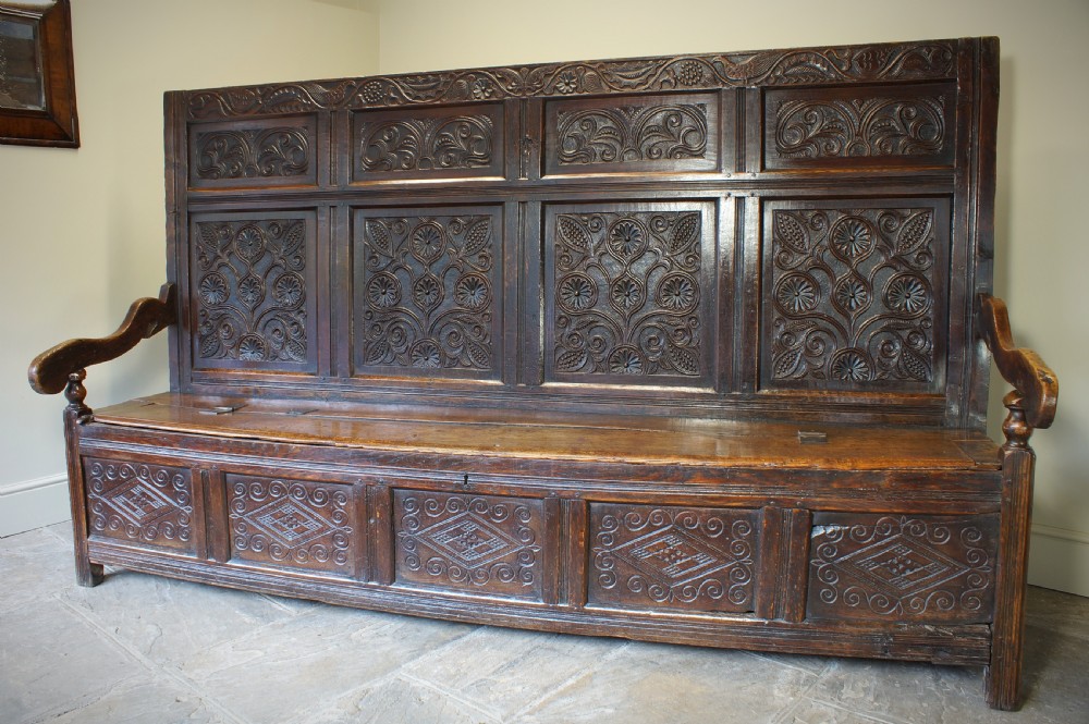 An Exceptional 17th Century Oak  Box Settle.