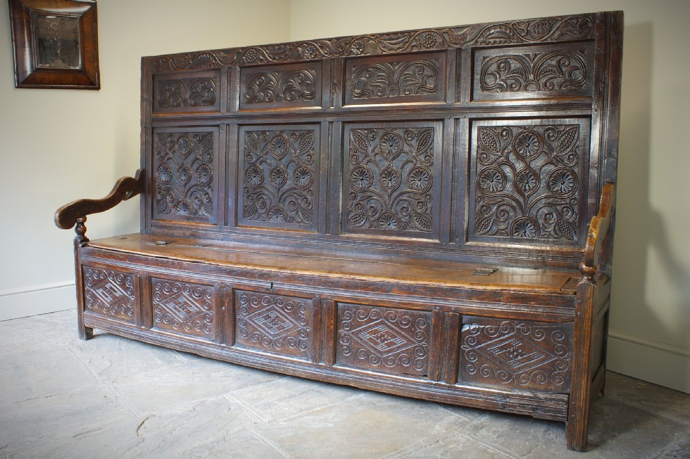 An Exceptional 17th Century Oak  Box Settle. View III