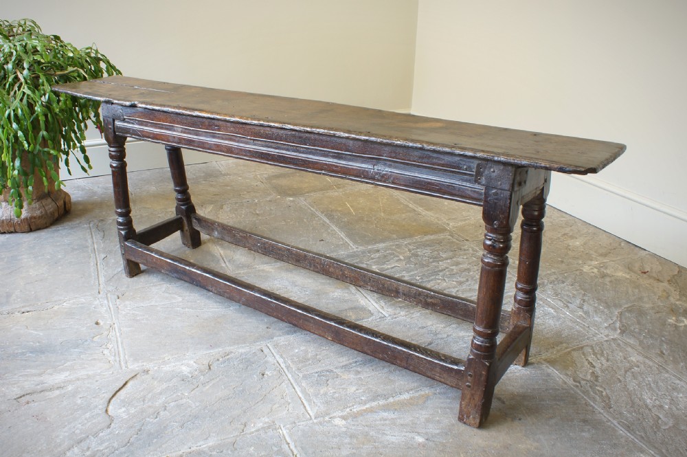 A 17th CENTURY JOINED OAK FORM OR BENCH, CIRCA 1640. View IX