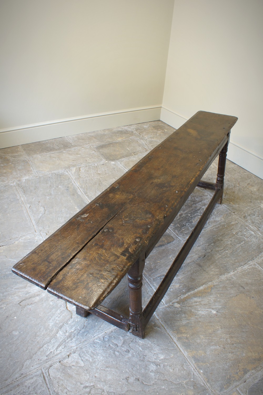 A 17th CENTURY JOINED OAK FORM OR BENCH, CIRCA 1640. View XIII