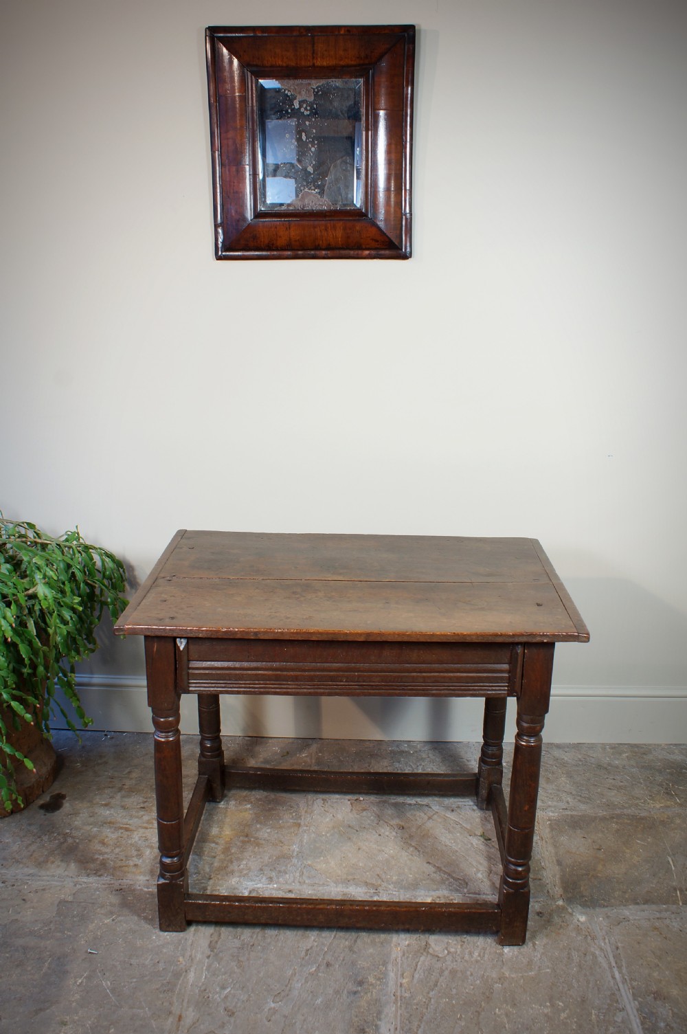 A seventeenth-century dark oak side table featuring a rectangular plank top, moulded apron, turned legs, and perimeter stretchers. View VIII