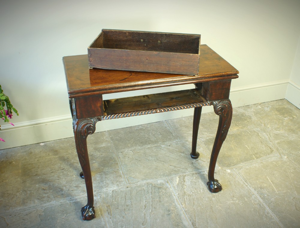 A George II mahogany fold-over card table featuring carved cabriole legs with ball-and-claw feet and a central drawer. View VIII