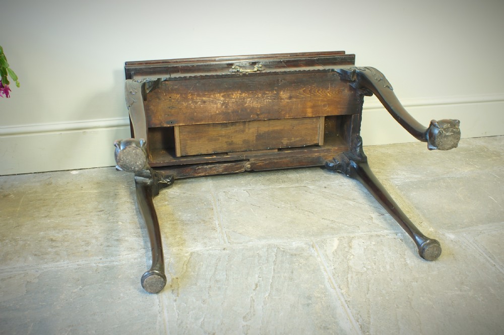 A George II mahogany fold-over card table featuring carved cabriole legs with ball-and-claw feet and a central drawer. View XIV