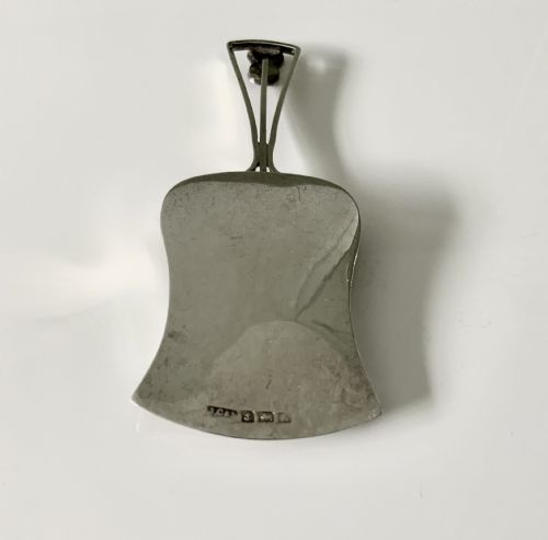 fig 1. Silver caddy spoon, unusual shape, thistle decoration
