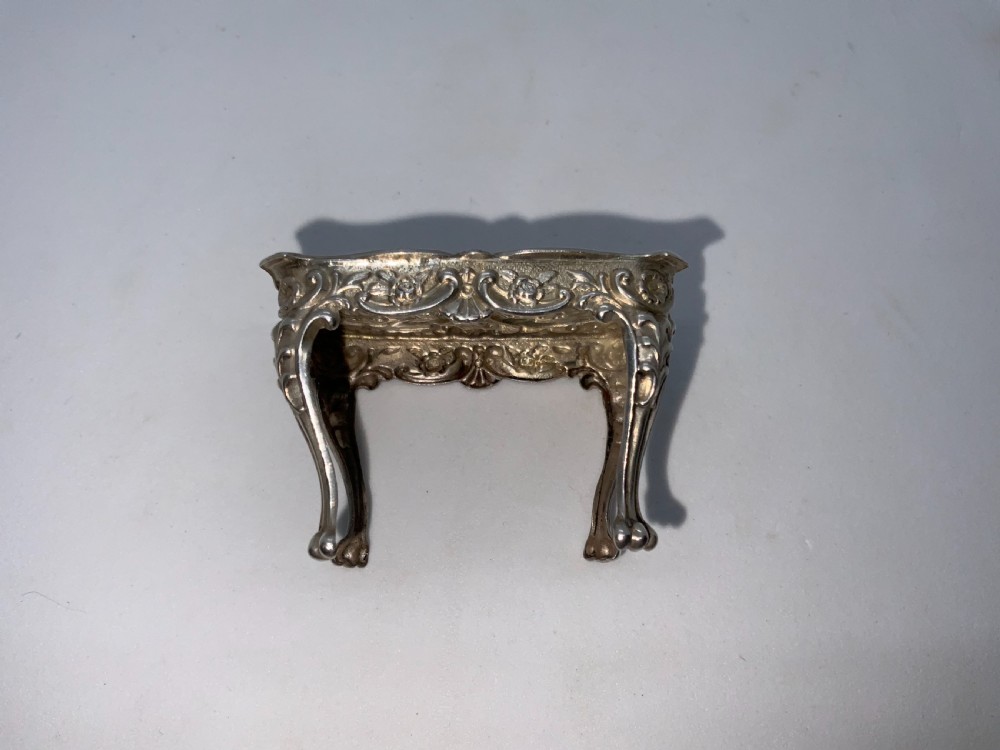 Miniature silver table and chairs. View IV