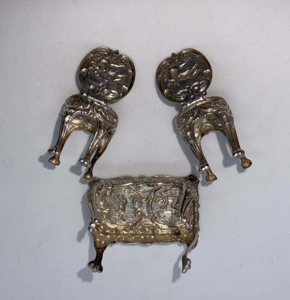 Miniature silver table and chairs. View V