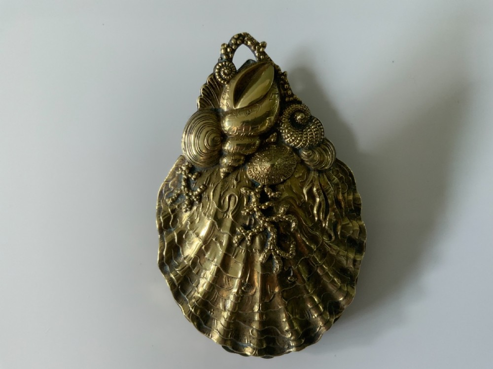 Brass scallop shaped paperclip