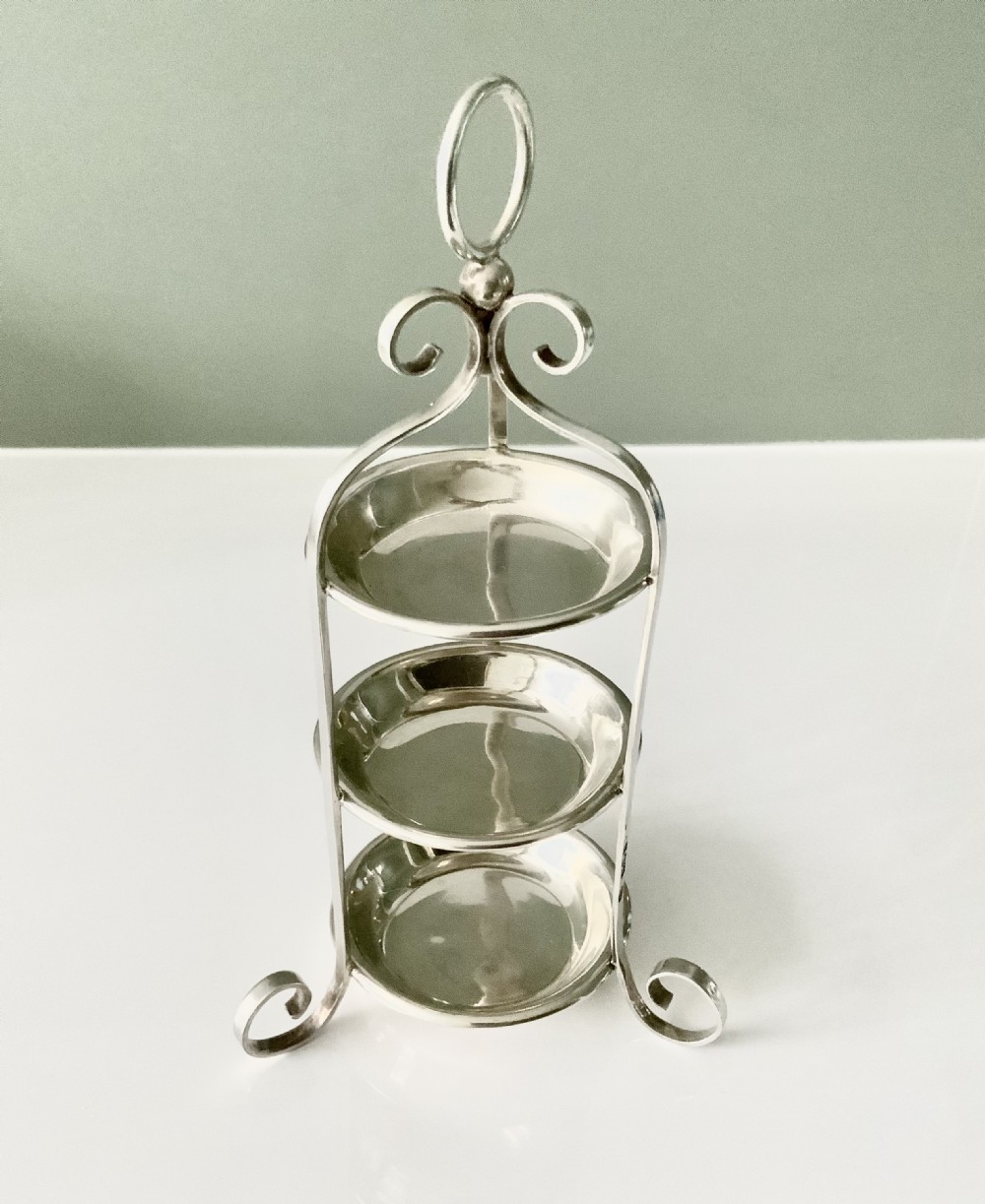 Silver tiered ring tray retailed by Kirby Beard & Sons